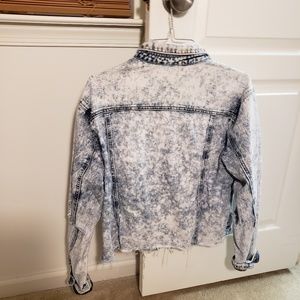 Acid wash denim jacket with distressed hem